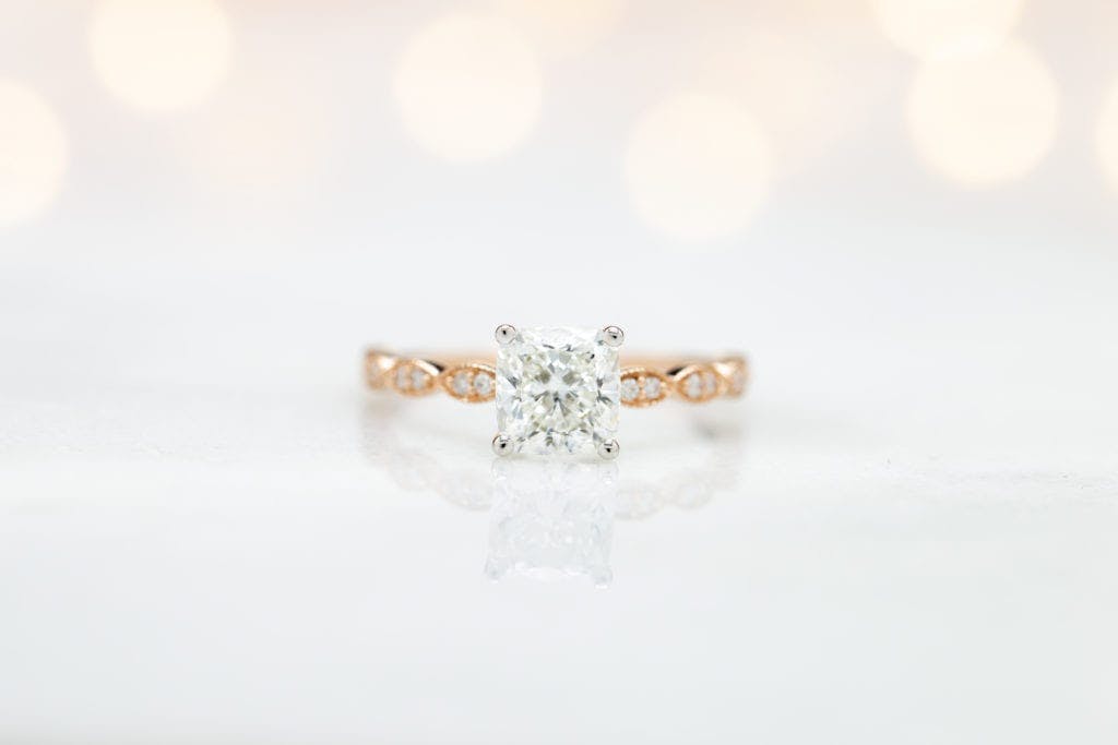cushion-cut diamonds - solitaire engagement ring in white and rose gold