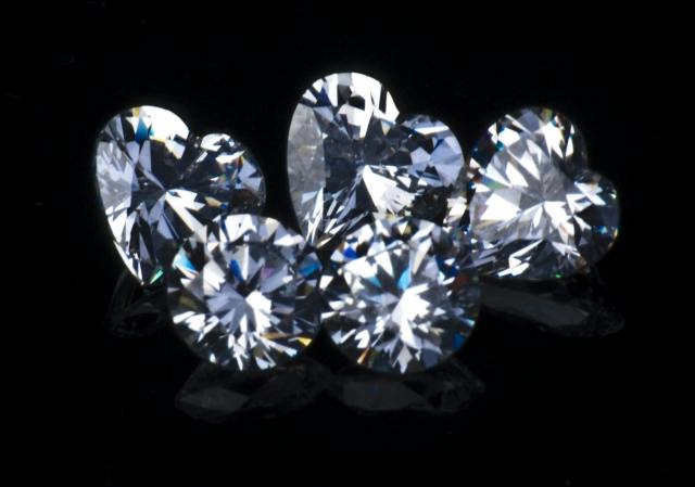 assorted diamonds - diamond overgrading
