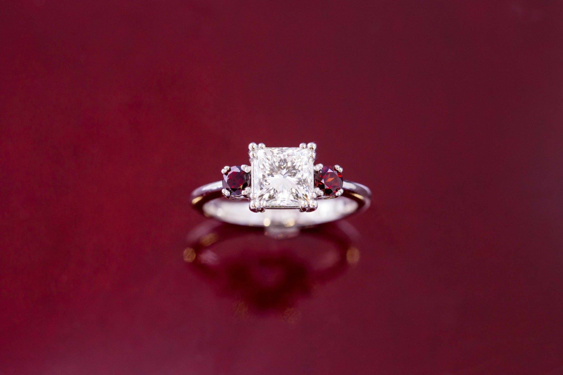 diamond and garnet platinum engagement ring - grading set gemstones
