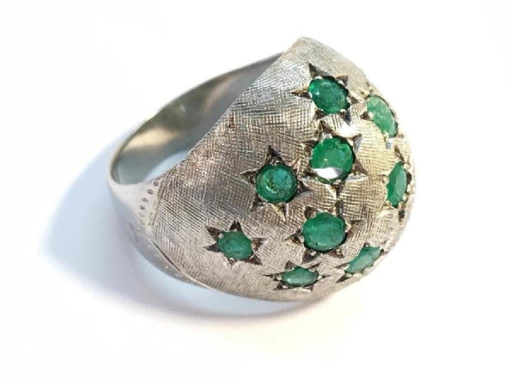 bombe ring with chipped emerald