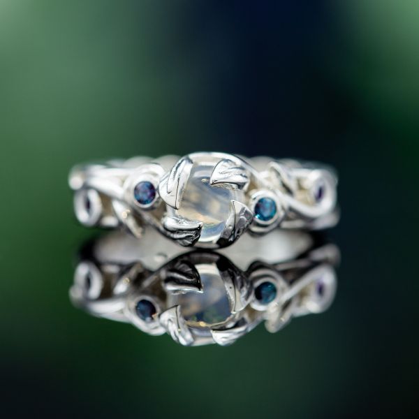The nature theme in this ring extends even to the petal prongs that hold the moonstone in place.