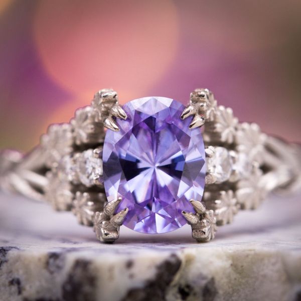 This flower-themed engagement ring is inspired by lavender and sets a cubic zirconia that perfectly suits the flower.