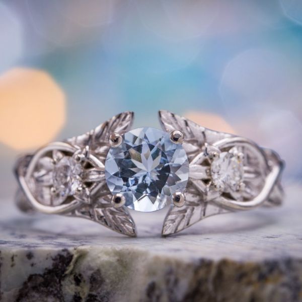 Inspired by Arwen's Evenstar pendant, this ring for a fantasy lover breaks with both the books and the movies, setting a clear blue aquamarine as its center stone.