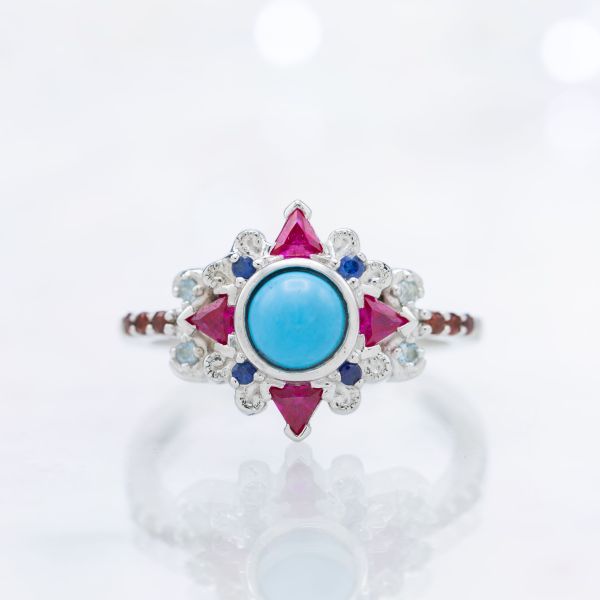 Vivid color play in this ring's blend of turquoise, ruby, sapphire, aquamarine, and garnet.