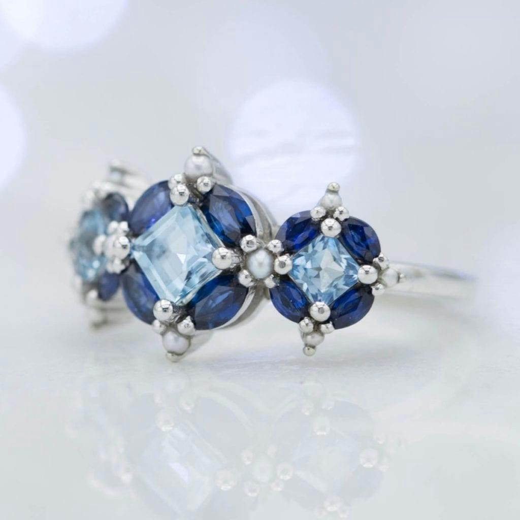 custom aquamarine, sapphire, and pearl ring