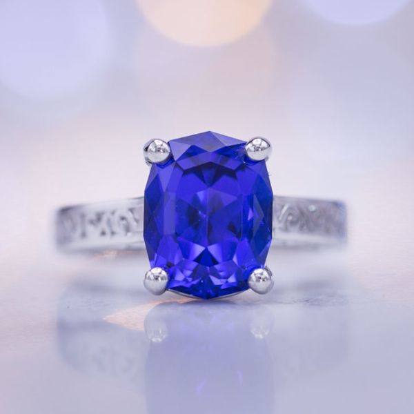 A violet-tinged rich blue color is the ideal shade for tanzanite, perfectly showcased in this stunning ring.