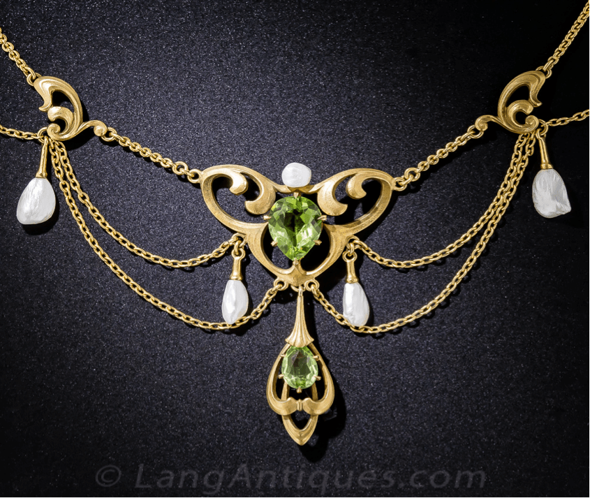 Belle Époque Jewelry Art Nouveau festoon necklace featuring two peridots 