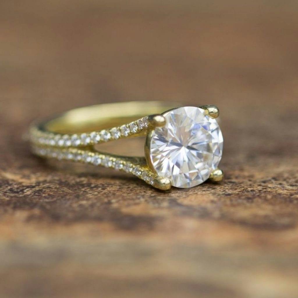 moissanite vs diamond - yellow gold pave split shank engagement ring with large moissanite