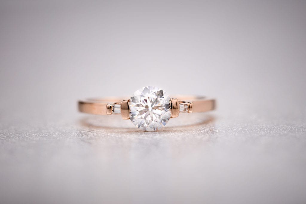 round diamond with baguette side stones - vintage engagement ring