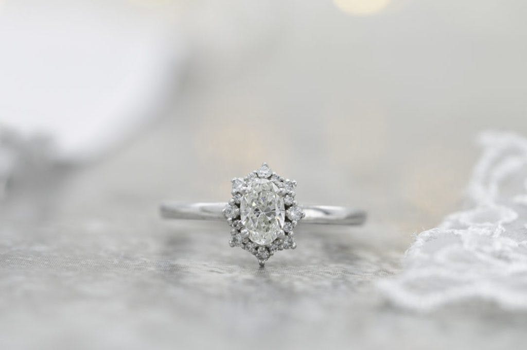 si oval diamond halo engagement ring
