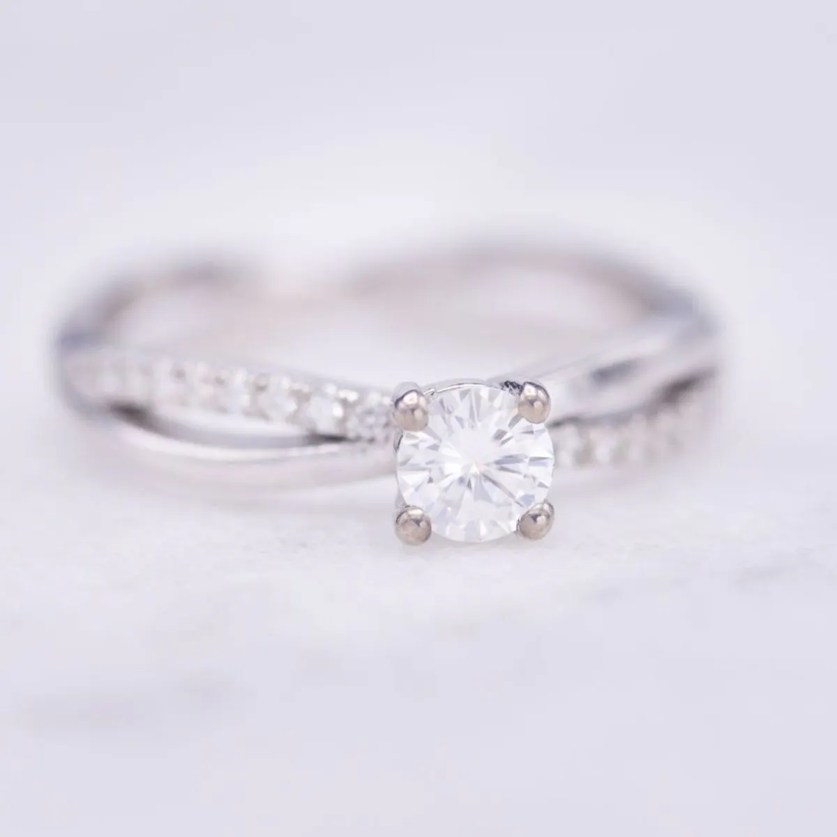 moissanite vs diamond - moissanite engagement ring twisting pave band
